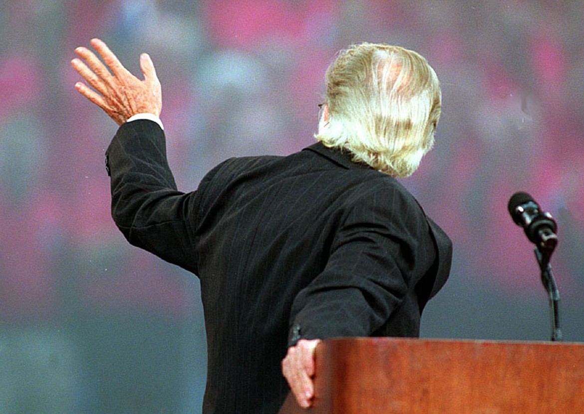 Evangelist Billy Graham waves to the choir at a Sunday evening service at Ericsson Stadium, closing his four-day crusade in September 1996. (Christopher A. Record/Charlotte Observer/TNS)