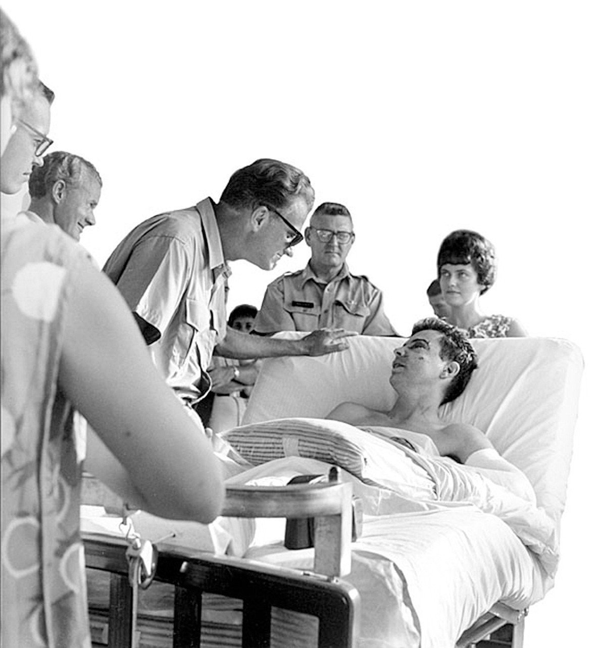 Billy Graham visiting injured troops during his 1966 trip to Vietnam. Graham was an early supporter of U.S. involvement in the war. (Graham archive/TNS)