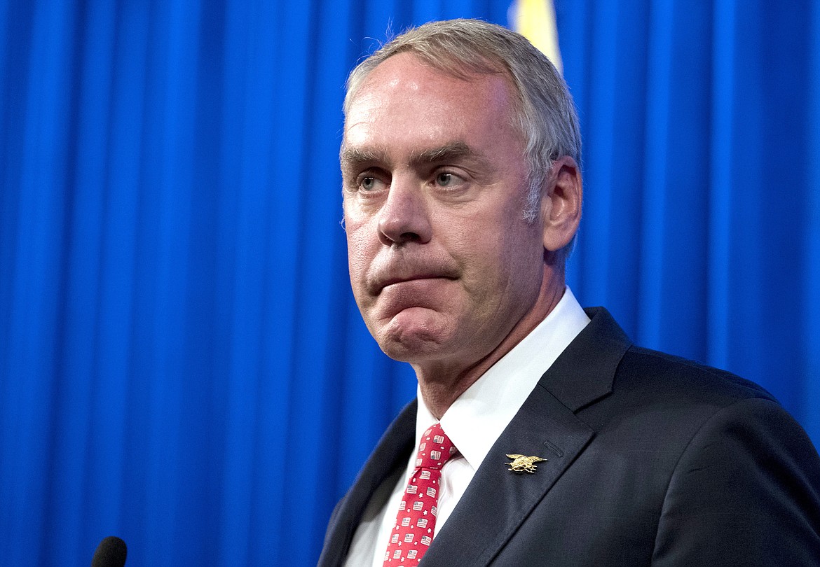 FILE - In this Sept. 29, 2017, file photo, Interior Secretary Ryan Zinke speaks about the Trump Administration&#146;s energy policy at the Heritage Foundation in Washington. Records show the Interior Department spent nearly $139,000 last year for construction at the agency that was labeled on a work order as &#147;Secretary&#146;s Door.&#148; A spokeswoman for Zinke did not provide answers on March 8, 2018, to questions about whether changes had been made to a door in the secretary&#146;s office.  (AP Photo/Andrew Harnik, File)