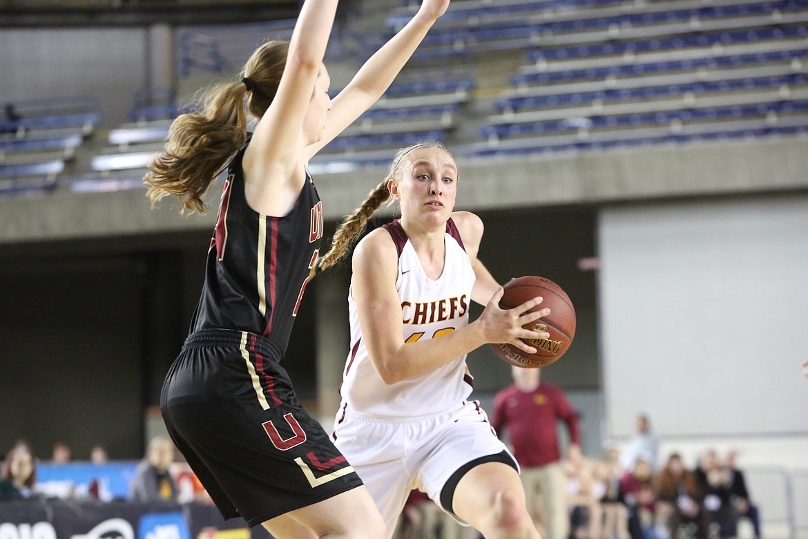 Connor Vanderweyst/Columbia Basin Herald
Moses Lake&#146;s Abby Rathbun (right) drives to the basket against University during the state quarterfinals Thursday at the Tacoma Dome. Rathbun had 17 points and five steals.