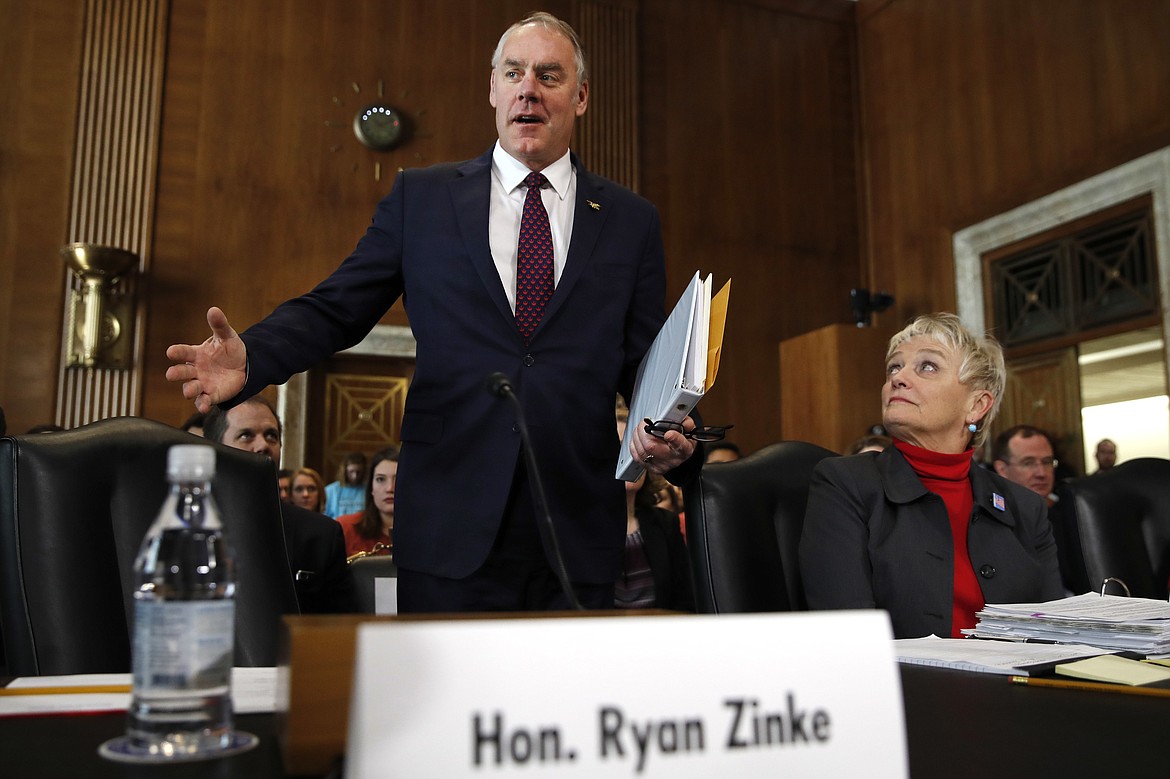 Interior Secretary Ryan Zinke arrives to testify before the Senate Committee on Energy and Natural Resources at a committee hearing on the President&#146;s Budget Request for Fiscal Year 2019, Tuesday, March 13, 2018, on Capitol Hill in Washington. At right is Olivia Barton Ferriter, with the Interior Department. (AP Photo/Jacquelyn Martin)