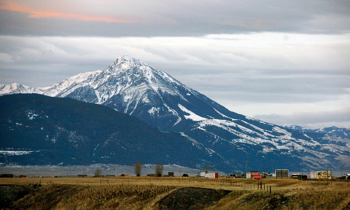 FILE - This Nov. 21, 2016, file photo shows Emigrant Peak towering over the Paradise Valley in Montana north of Yellowstone National Park, the day U.S. officials announced a ban on new mining claims across more than 30,000 acres in the area. U.S. government officials are moving forward with a plan to block new gold mining claims for 20 years on more than 30,000 acres of public lands north of Yellowstone National Park. The U.S. Forest Service released a draft environmental assessment on Thursday, March 29, 2018, for the proposed withdrawal of lands in the Absaroka mountains from new claims for gold and other &quot;locatable&quot; minerals, such as silver, platinum and uranium. (AP Photo/Matthew Brown, File)