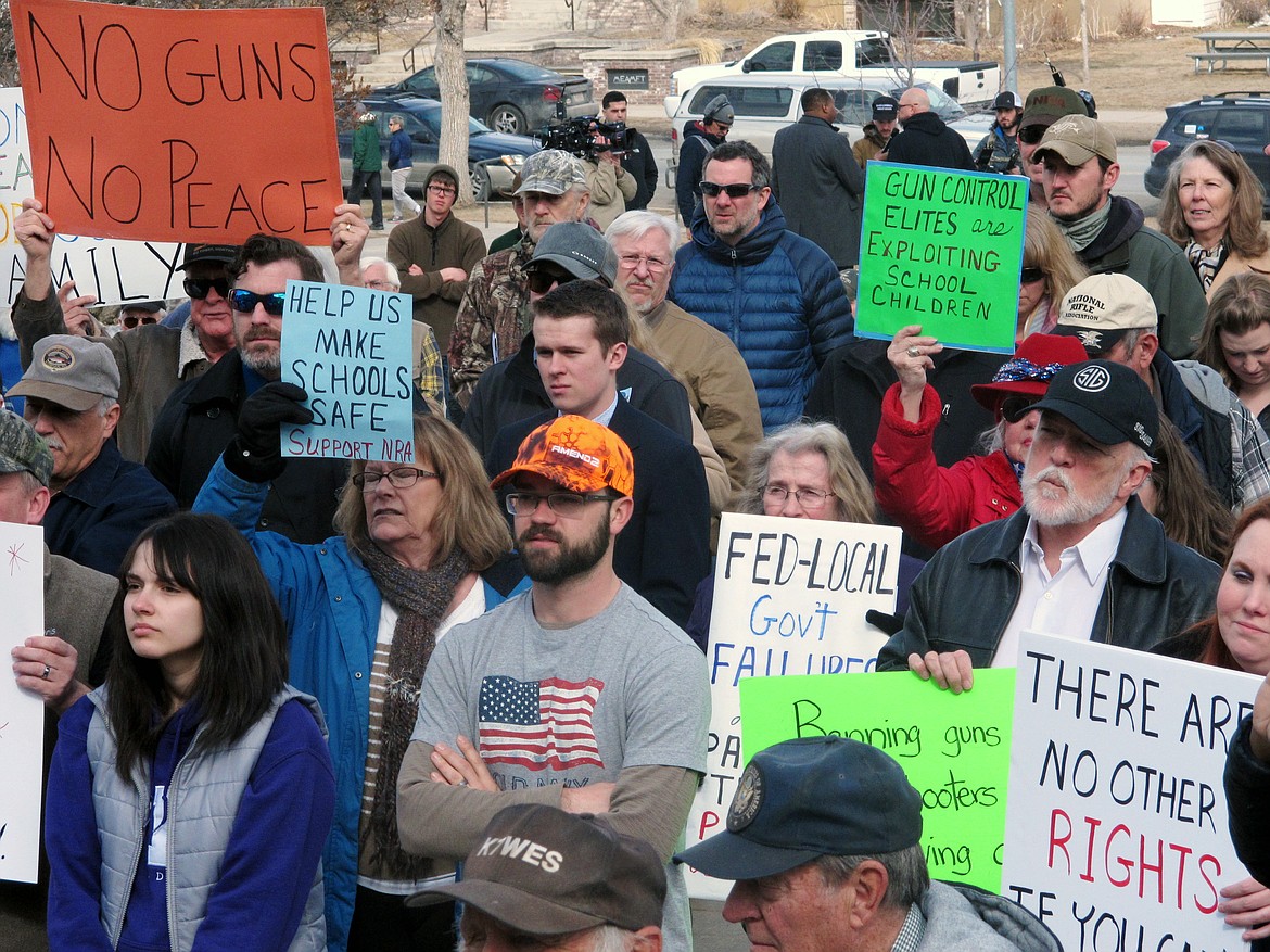 Gun-rights advocates rally during a protest at the Montana Capitol on Saturday, March 24, 2018, in Helena, Mont. The counter-protest was held at the same time and across town from the larger rally held by students and gun-control advocates. (AP Photo/Matt Volz)