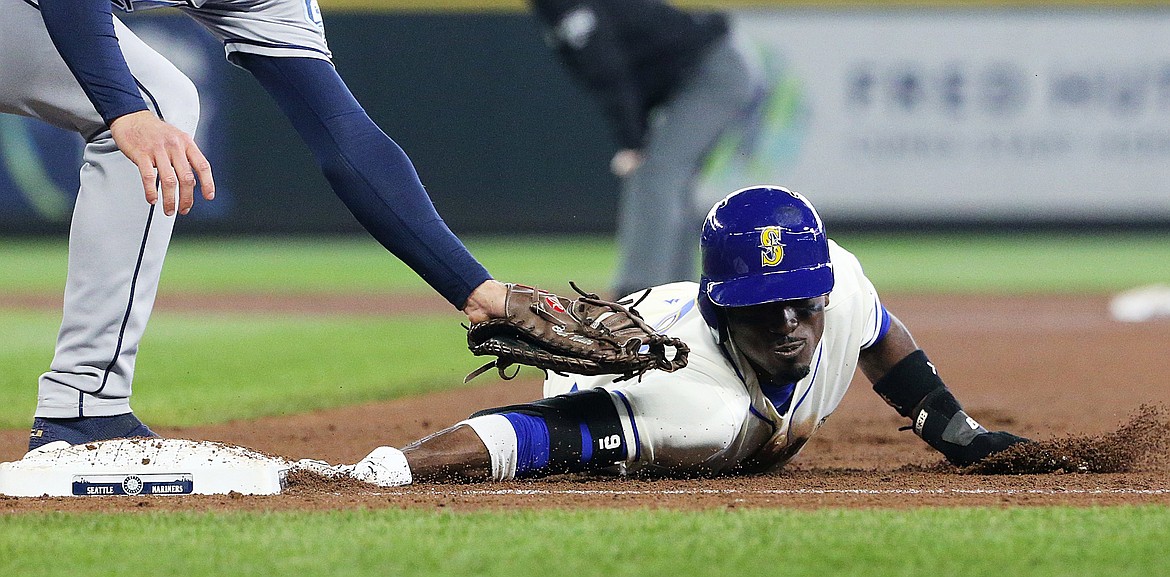 Seattle Mariners second baseman Dee Gordon hustles safely back to first base in the fourth inning during a Tampa Bay Rays pickoff play on Sunday, June 3, 2018, at Safeco Field in Seattle, Wash. The Rays challenged and the call was upheld: safe. (Ken Lambert/Seattle Times/TNS)