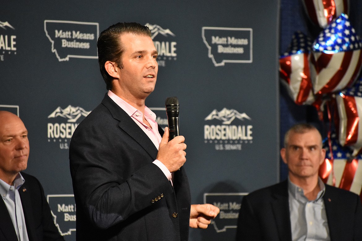 Donald Trump Jr., center, speaks to Montana Republicans at the state party's annual convention as U.S Rep. Greg Gianforte, left, and senate candidate Matt Rosendale, right, look on, at the Billings Hotel and Convention Center Friday, June 22, 2018, in Billings, Mont. Trump Jr. warned Republicans that Democrats are highly motivated heading into the November election. (AP Photo/Matthew Brown)