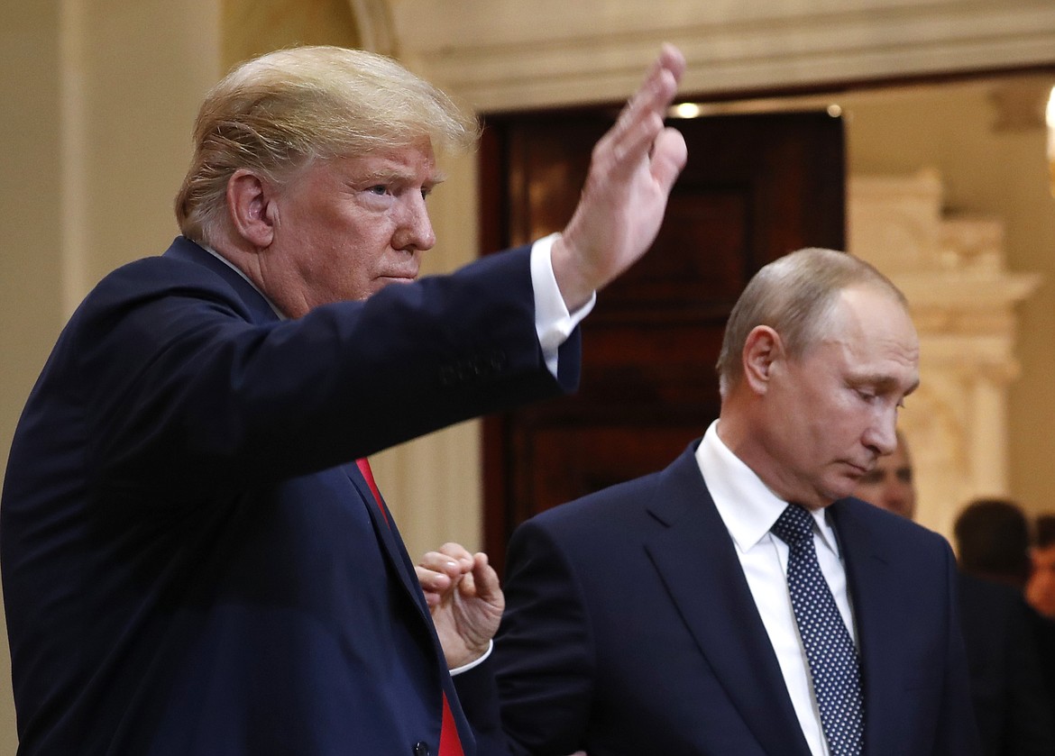 U.S. President Donald Trump, let, waves as he leaves after a press conference with Russian President Vladimir Putin after their meeting at the Presidential Palace in Helsinki, Finland, Monday, July 16, 2018. (AP Photo/Pablo Martinez Monsivais)