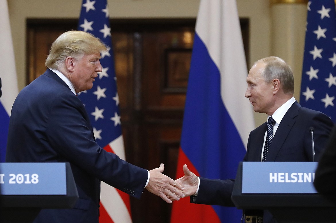 U.S. President Donald Trump shakes hand with Russian President Vladimir Putin at the end of the press conference after their meeting at the Presidential Palace in Helsinki, Finland, Monday, July 16, 2018. (AP Photo/Alexander Zemlianichenko)