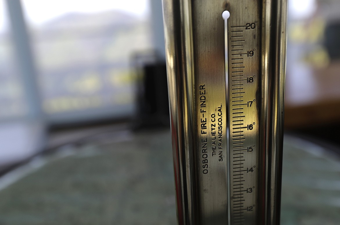 In this Wednesday, July 18, 2018, photo, the rear sight of a device called the Osborne Fire-Finder that is used to pinpoint the location of smoke or fires spotted from the Coolwater Fire Lookout, is shown at the lookout in the Nez Perce-Clearwater National Forests near Lowell, Idaho. (AP Photo/Ted S. Warren)