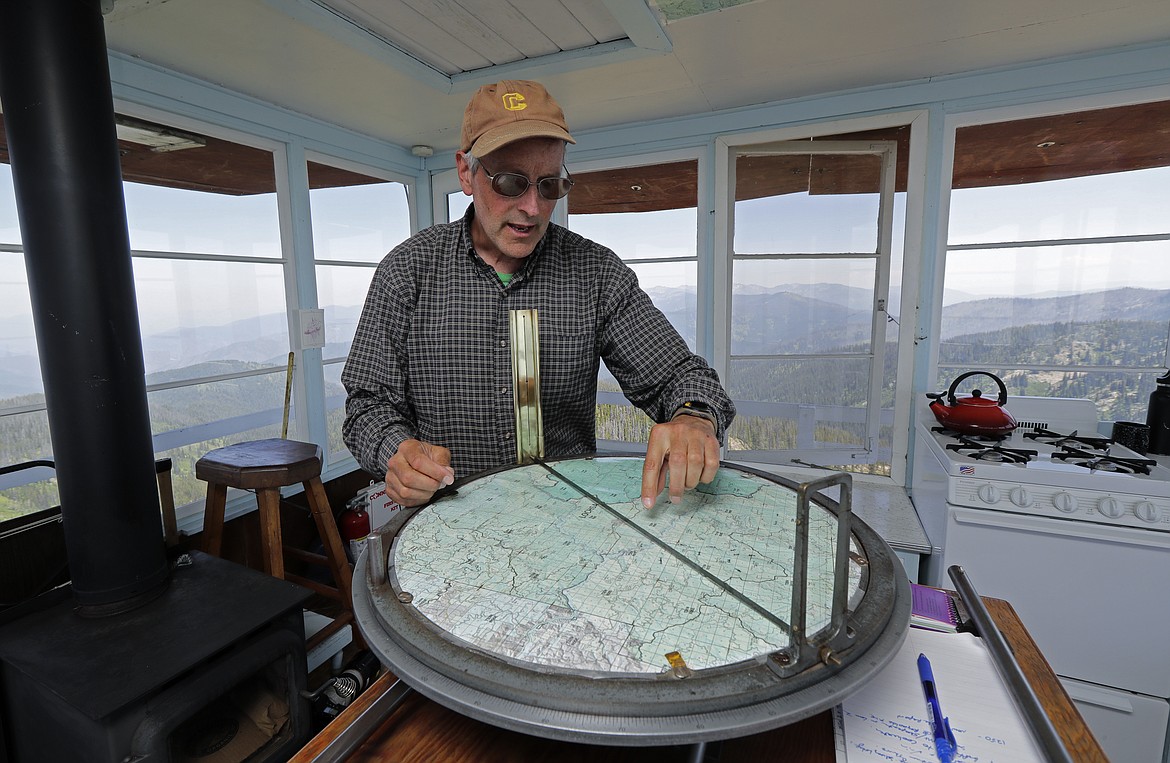 Tom VandeWater explains how he uses a device called the Osborne Fire-Finder to pinpoint the location of any smoke or fires he spots from the U.S. Forest Service Coolwater Fire Lookout.