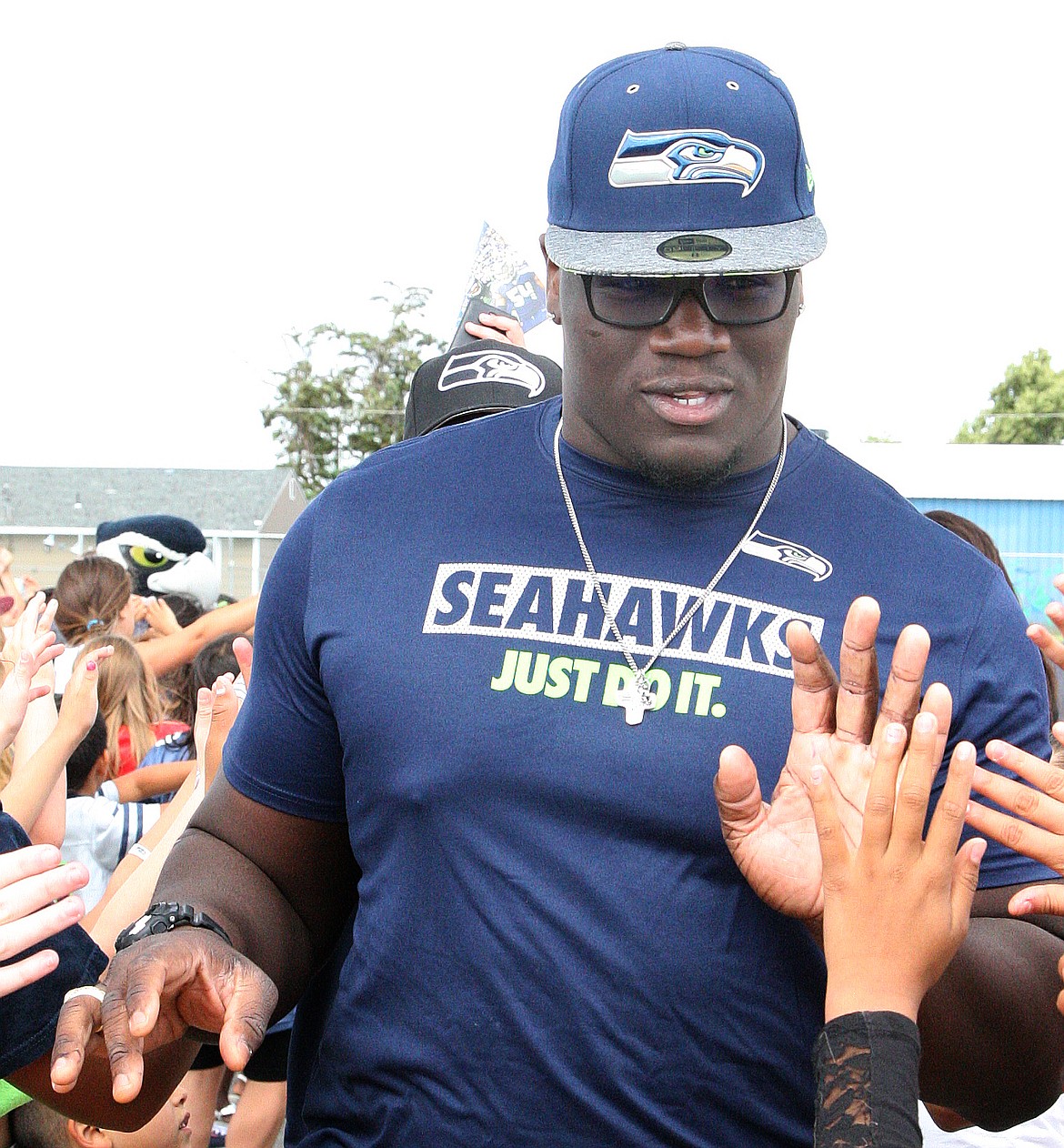 File photo
Seattle Seahawks No. 1 draft choice Germain Ifedi high fives his way through a tunnel of fans at North Elementary School in 2016.