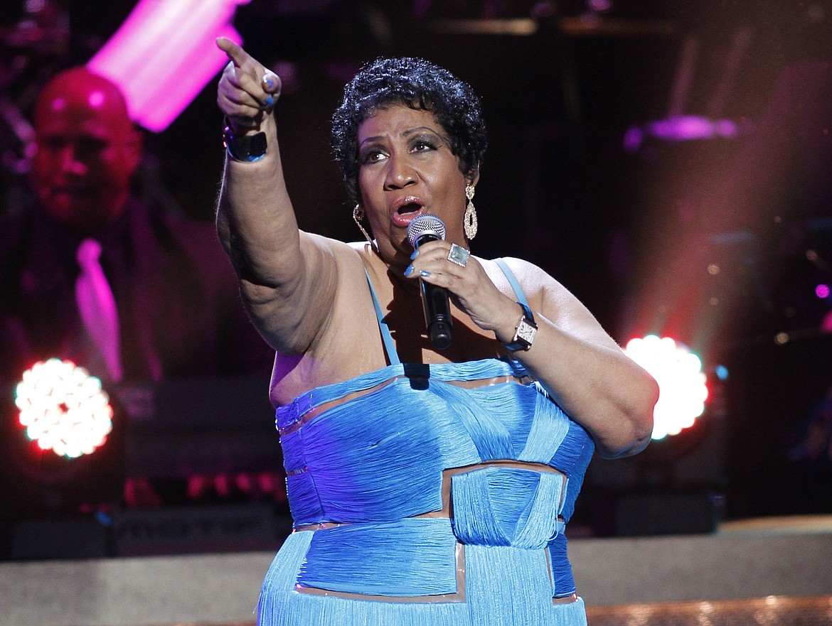 FILE - This Jan. 14, 2012 file photo, shows singer Aretha Franklin performing during the BET Honors at the Warner Theatre in Washington.  Franklin died Thursday, Aug. 16, 2018 at her home in Detroit.  She was 76.  (AP Photo/Jose Luis Magana, File)