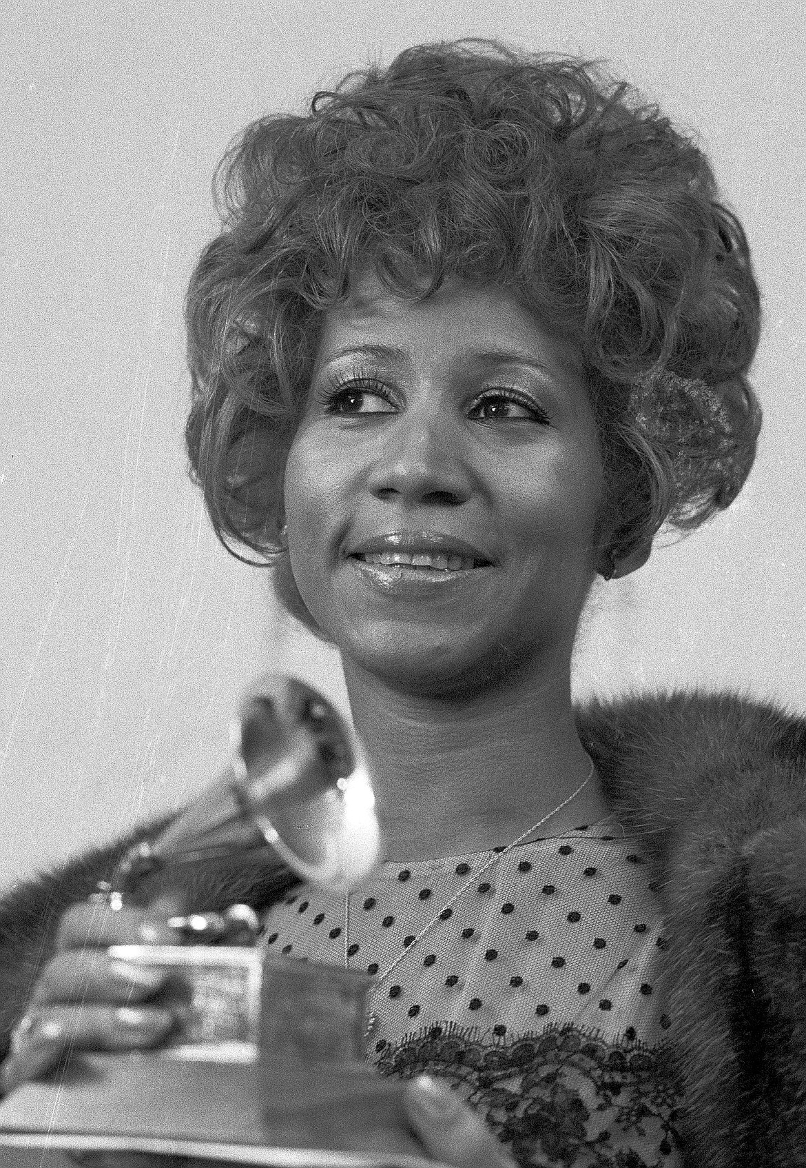 FILE - In this March 13, 1972 file photo, Aretha Franklin holds her Grammy Award for Best Rhythm and Blue performance of the song &quot;Bridge Over Troubled Waters,&quot;  in New York.  Franklin died Thursday, Aug. 16, 2018 at her home in Detroit.  She was 76. (AP Photo/Dave Pickoff, File)