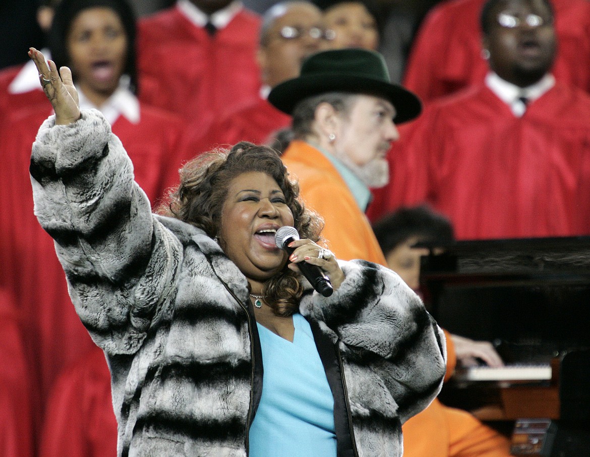 FILE - In this Feb. 5, 2006 file photo, Aretha Franklin and Dr. John, background on piano, perform the national anthem before the Super Bowl XL football game in Detroit.  Franklin died Thursday, Aug. 16, 2018 at her home in Detroit.  She was 76.  (AP Photo/Gene J. Puskar, File)