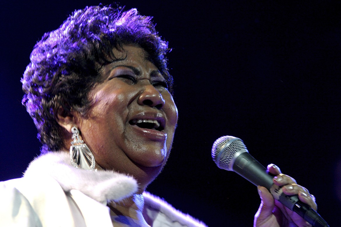 FILE - In this Nov. 21, 2008 file photo, Aretha Franklin performs at the House of Blues in Los Angeles.   Franklin died Thursday, Aug. 16, 2018 at her home in Detroit.  She was 76.  (AP Photo/Shea Walsh, file)