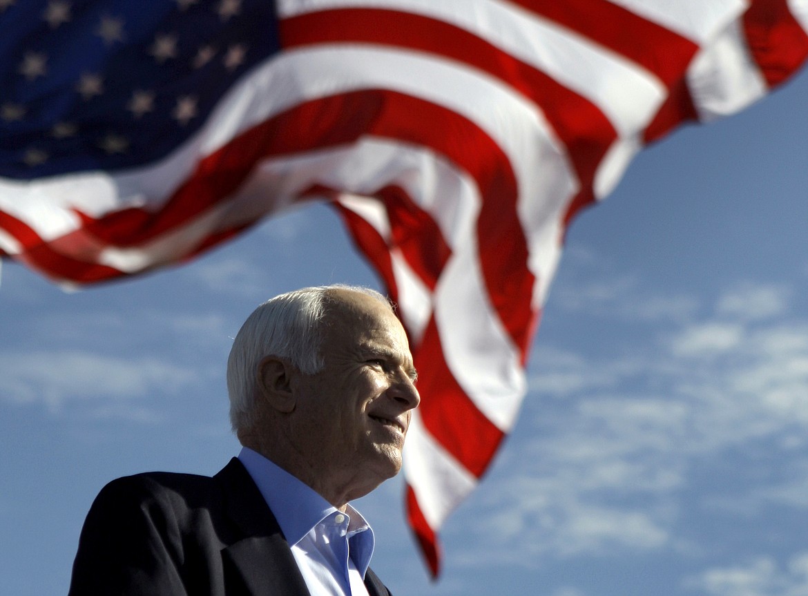 FILE - In this Nov. 3, 2008 file photo, Republican presidential candidate Sen. John McCain, R-Ariz. speaks at a rally outside Raymond James Stadium in Tampa, Fla. McCain's family says the Arizona senator has chosen to discontinue medical treatment for brain cancer.  (AP Photo/Carolyn Kaster))