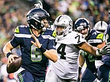 Manuel tosses 3 TDs as Raiders topple Seahawks 30-19
