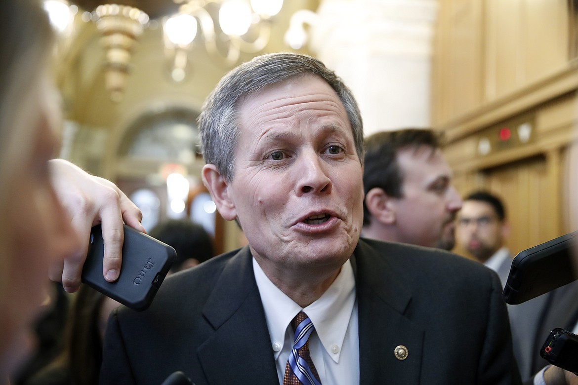 Sen. Steve Daines, R-Mont., smiles as he talks with reporters after a vote to advance Brett Kavanaugh&#146;s nomination to the Supreme Court, on Capitol Hill, Friday, Oct. 5, 2018 in Washington. (AP Photo/Alex Brandon)