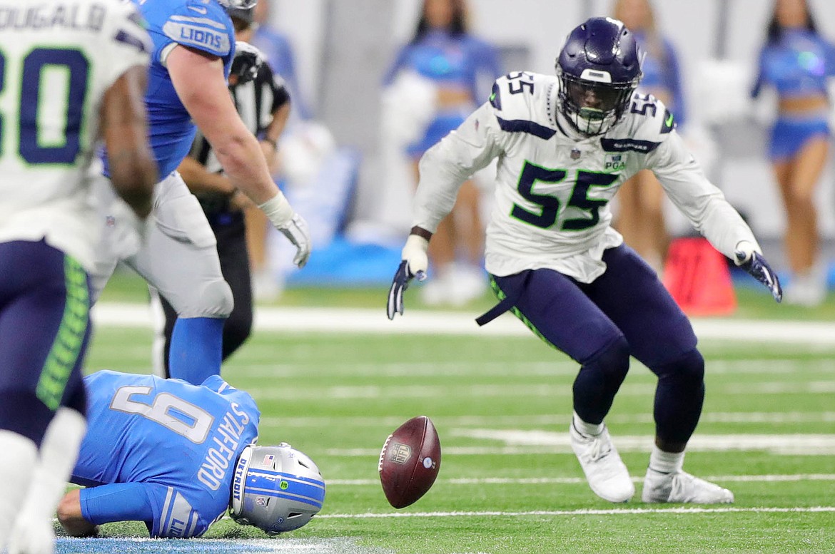 Detroit Lions quarterback Matthew Stafford fumbles the ball trying to scramble as Seattle Seahawks defensive end Frank Clark tries to recover the ball during fourth quarter action on Sunday, Oct. 28, 2018 at Ford Field in Detroit, Mich. (Kirthmon F. Dozier/Detroit Free Press/TNS)