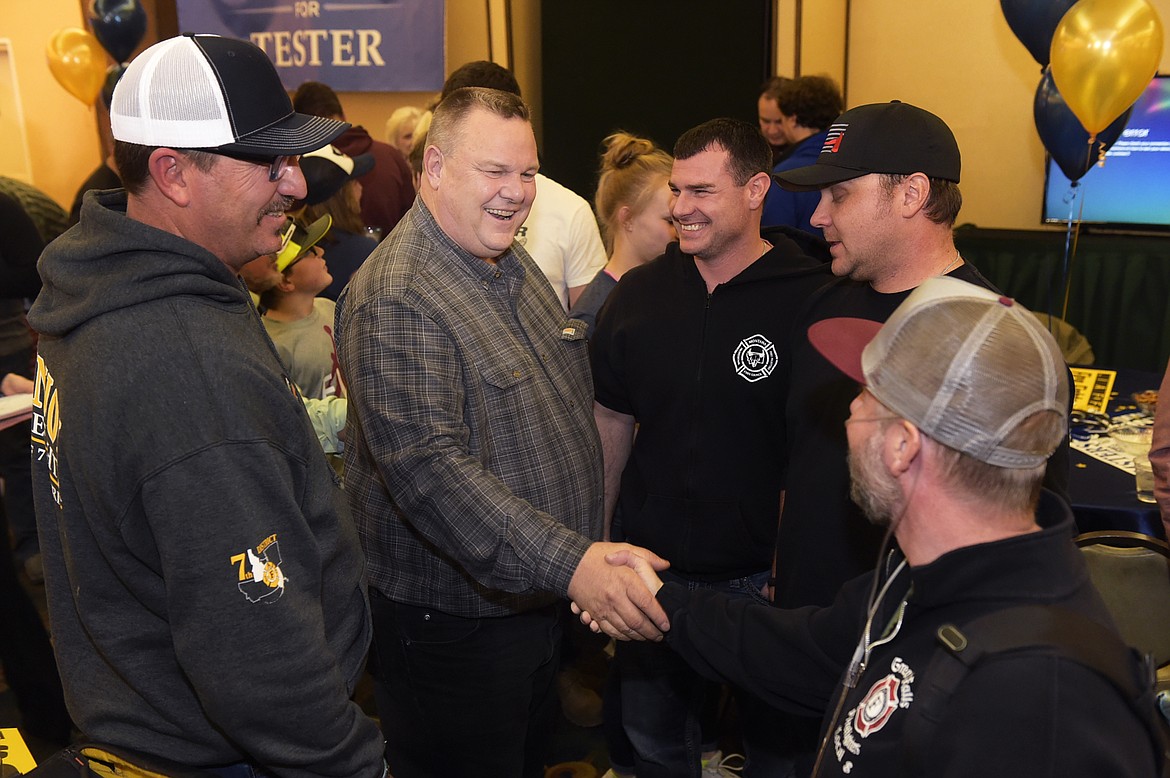 Montana Senator Jon Tester meets with supporters Tuesday, Nov. 6, 2018, at his election party in Great Falls, Mont.  (Thom Bridge/Independent Record via AP)