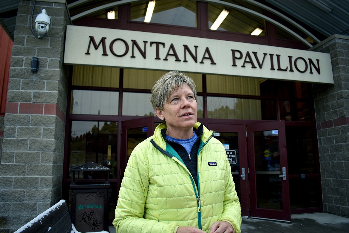 Lynne Fitzgerald talks about the Montana U.S. Senate and House races in front of a polling station at MetraPark in Billings, Mont., on Tuesday, Nov. 6, 2018. (AP Photo/Matthew Brown)