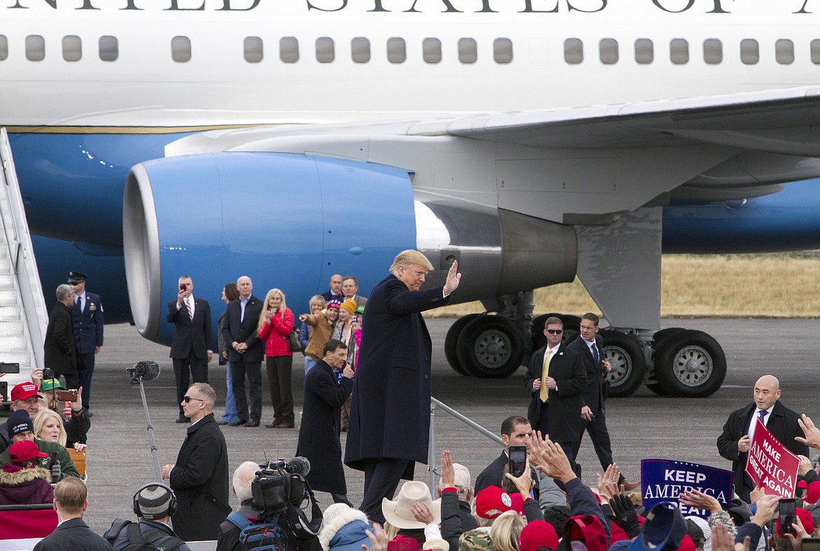 President Donald Trump waves as he walks to Air Force One after a campaign rally at Bozeman Yellowstone International Airport, Saturday, Nov. 3, 2018, in Belgrade, Mont. (AP Photo/Janie Osborne)