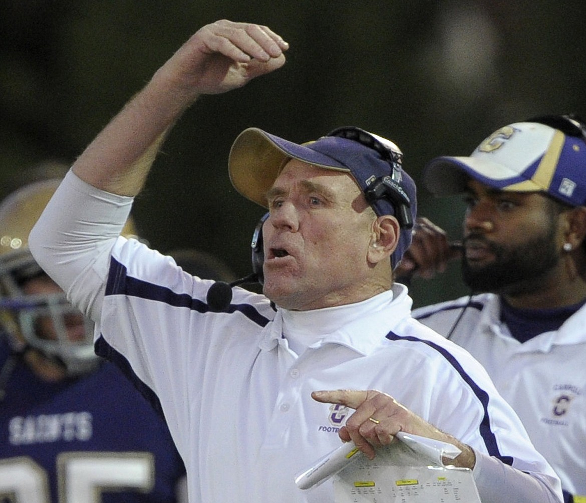 FILE - In this Dec. 17, 2011, file photo, Carroll College head coach head coach Mike Van Diest is shown during a game against Saint Xavier during the first half of an NAIA national championship college football game in Rome, Ga. Van Diest announced his retirement Monday, Nov. 12, 2018, after 20 seasons and six NAIA national championships at the Helena school. (AP Photo/John Amis, File)