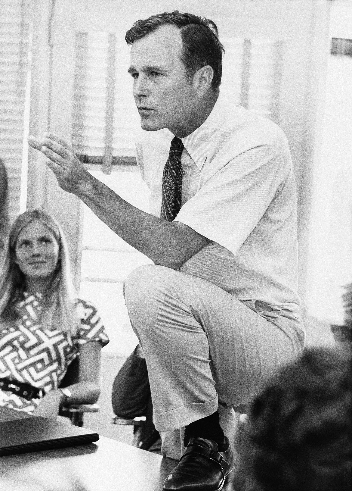 FILE - In this Oct. 9, 1970 file photo, Rep. George H.W. Bush, R-Texas, talks with a group of young people at a rally in Houston, Texas. Bush died at the age of 94 on Friday, Nov. 30, 2018, about eight months after the death of his wife, Barbara Bush. (AP Photo/File)