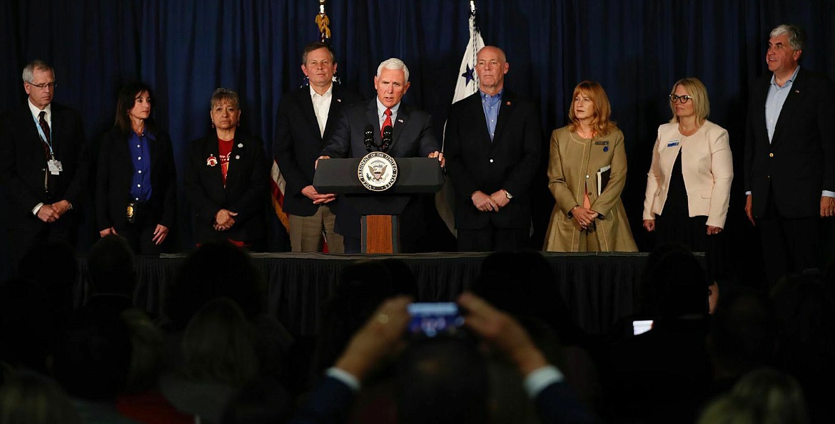 Vice President Mike Pence, Sen. Steve Daines and Rep. Greg Gianforte met with Montana and Billings officials to hear about the meth issues facing the state in Billings, Mont. on Wednesday, June 12, 2019. (Casey Page/Billings Gazette via AP)