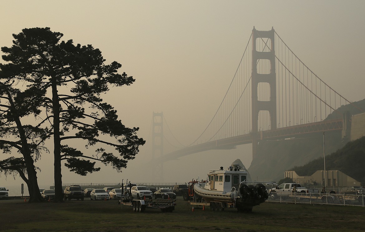 FILE - In this Nov. 16, 2018, file photo, the Golden Gate Bridge is obscured by smoke and haze from wildfires in this view from Fort Baker near Sausalito, Calif. Tens of millions of people in the Western US face a growing health risk due to wildfires as more intense and frequent blazes churn out greater volumes of lung-damaging smoke, according to research scientists at NASA and several major universities. (AP Photo/Eric Risberg, File)