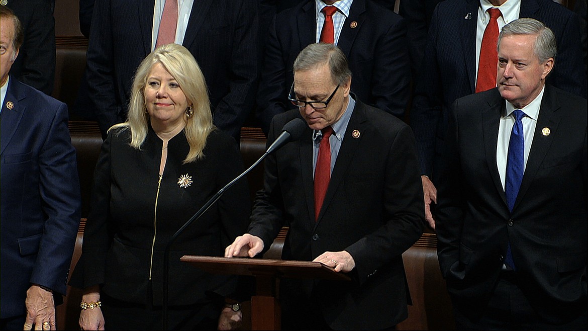 Rep. Andy Biggs, R-Ariz., makes a motion for the House to adjourn as the House of Representatives debates the articles of impeachment against President Donald Trump at the Capitol in Washington, Wednesday, Dec. 18, 2019. At left is Rep. Debbie Lesko, R-Ariz., and at right is Rep. Mark Meadows, R-N.C. (House Television via AP)