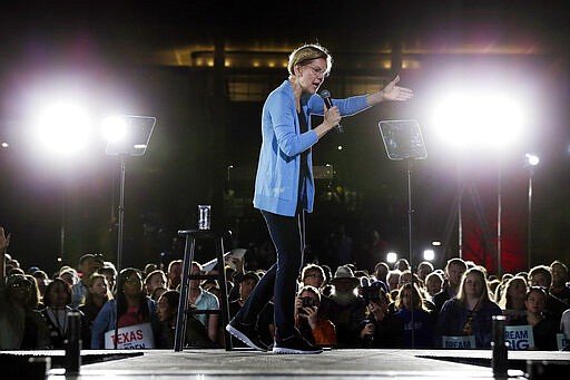 Democratic presidential candidate Sen. Elizabeth Warren, D-Mass., speaks to supporters during a town hall Thursday, Feb. 29, 2020, at Discovery Green in Houston. (AP Photo/Michael Wyke)