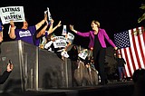The Latest: Warren cheers Latina janitors who won higher pay