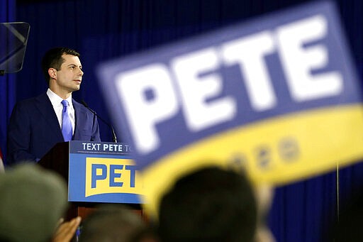 FILE - In this Feb. 11, 2020 file photo, Democratic presidential candidate former South Bend, Ind., Mayor Pete Buttigieg pauses as he speaks to supporters at a primary night election rally in Nashua, N.H. Buttigieg&#146;s presidential candidacy, though ending far short of its goal, will likely go down in history books as a success: proof of the remarkable advances made by LGBT Americans in their quest for equality and acceptance.  (AP Photo/Mary Altaffer)