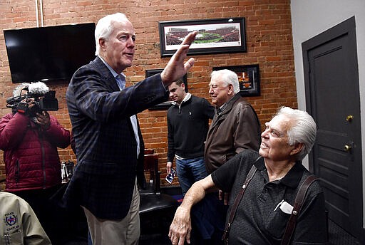 U.S. Sen. John Cornyn Cornyn waves to a supporter before speaking to a small group of supporters and media at Cypress Street Station, a restaurant in Abilene, Texas, during a campaign stop, Tuesday, March 3, 2020, during the state's primary election. Cornyn is facing four primary challengers Tuesday. (Ronald W. Erdrich/The Abilene Reporter-News via AP)