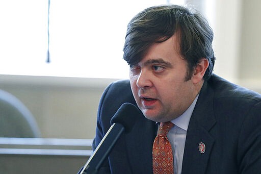 House Judiciary B Committee Chairman Nick Bain, a Republican from Corinth, explains the facets of House Bill 1295 that would prohibit abortion if a woman is seeking the procedure because of the race, sex or genetic abnormality of the fetus, to committee members at the Capitol in Jackson, Miss., Tuesday, March 3, 2020. The only exception would be in case of a medical emergency. The bill, which passed the committee, now goes to the full House for action. (AP Photo/Rogelio V. Solis)