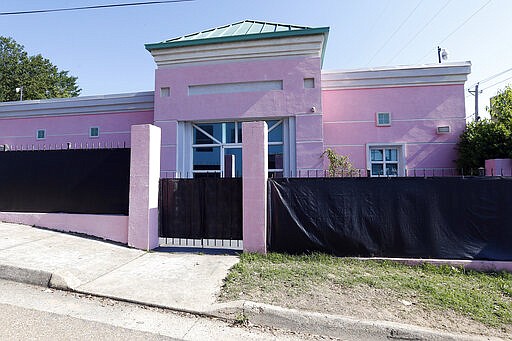 FILE - This Friday, May 17, 2019 file photo shows the Jackson Women's Health Organization in Jackson, Miss. The facility is the state's only abortion clinic. A federal appeals court is keeping a block on a Mississippi law that would ban most abortions at about six weeks, a stage when many women may not even know they are pregnant. (AP Photo/Rogelio V. Solis, File)