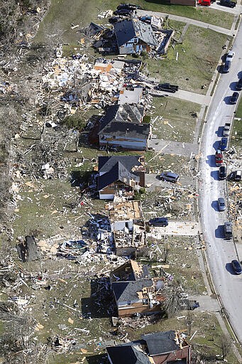 Destroyed homes line a street Tuesday, March 3, 2020, near Lebanon, Tenn. Tornadoes ripped across Tennessee early Tuesday, shredding more than 140 buildings and burying people in piles of rubble and wrecked basements. (AP Photo/Mark Humphrey)