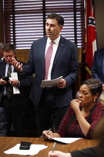 Secretary of State Michael Watson discusses proposed legislation dealing with voters' proof of U.S. citizenship, during a meeting of the Senate Accountability, Efficiency and Transparency Committee at the Capitol in Jackson, Miss., Tuesday, March 3, 2020. (AP Photo/Rogelio V. Solis)