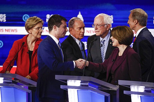 From left, Democratic presidential candidates, Sen. Elizabeth Warren, D-Mass., former South Bend Mayor Pete Buttigieg, former New York City Mayor Mike Bloomberg, Sen. Bernie Sanders, I-Vt., Sen. Amy Klobuchar, D-Minn., and businessman Tom Steyer, greet on another on stage at the end of the Democratic presidential primary debate at the Gaillard Center, Tuesday, Feb. 25, 2020, in Charleston, S.C., co-hosted by CBS News and the Congressional Black Caucus Institute. (AP Photo/Patrick Semansky)