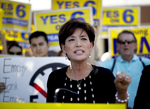 FILE - This Oct. 1, 2018 file photo shows Young Kim, a Republican candidate who is running for a U.S. House seat in the 39th District in California, speaks at a anti-gas tax rally in Fullerton, Calif. California is one of the most heavily Democratic states in the country, but Republicans this year are determined to regain a string of U.S. House seats the party lost to Democrats two years ago. President Donald Trump, who wants the House back under GOP control and House Speaker Nancy Pelosi demoted, has said that with hard work Republicans &quot;can pick up seven seats in the state of California.&quot;(AP Photo/Chris Carlson, File)