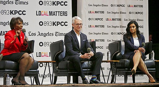 FILE - In this Jan. 29, 2020, file photo, Los Angeles County District Attorney Jackie Lacey, left, and her two challengers, former San Francisco District Attorney George Gascon, middle, and former public defender Rachel Rossi participate at the L.A. District Attorney candidates debate in Los Angeles. (AP Photo/Damian Dovarganes, File)