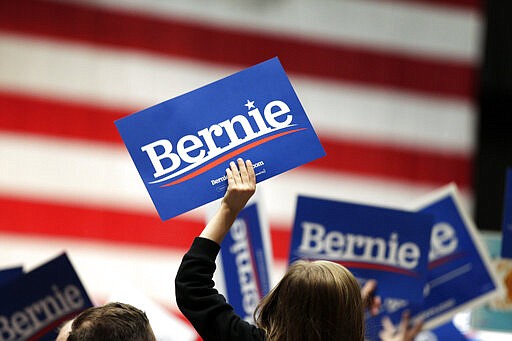 Supporters for Democratic presidential candidate Sen. Bernie Sanders, I-Vt., cheer before a campaign rally, Monday, March 2, 2020, in St. Paul, Minn. The abrupt withdrawal of Amy Klobuchar from the presidential race gives front-runner Bernie Sanders a sudden opportunity for locking up her home state on Super Tuesday. (AP Photo/Andy Clayton-King)