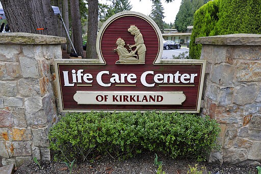 A sign at the entrance of the Life Care Center is shown in Kirkland, Wash., near Seattle, Tuesday, March 3, 2020. Dozens of people associated with the facility are reportedly ill with respiratory symptoms or hospitalized and are being tested for the COVID-19 coronavirus. (AP Photo/Ted S. Warren)