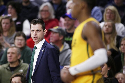 San Francisco coach Todd Golden, left, speaks with guard Jamaree Bouyea during the second half of the team's NCAA college basketball game against Gonzaga in Spokane, Wash., Thursday, Feb. 20, 2020. Gonzaga won 71-54. (AP Photo/Young Kwak)