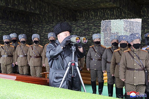 FILE - In this Friday, Feb. 28, 2020, file photo provided on Feb. 29, 2020 by the North Korean government, North Korean leader Kim Jong Un, center, inspects the military drill of units of the Korean People's Army, with soldiers shown wearing face masks. Independent journalists were not given access to cover the event depicted in this image distributed by the North Korean government. The content of this image is as provided and cannot be independently verified. Korean language watermark on image as provided by source reads: &quot;KCNA&quot; which is the abbreviation for Korean Central News Agency. (Korean Central News Agency/Korea News Service via AP, File)