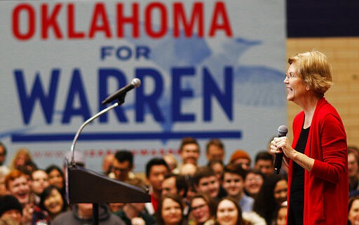 FILE - In this Sunday, Dec. 22, 2019, file photo, Democratic presidential candidate Sen. Elizabeth Warren reacts as she speaks during her campaign stop in Oklahoma City at Northwest Classen High School, her alma mater. Warren hopes her roots in the state will help propel her to success in Oklahoma on Super Tuesday. (Doug Hoke/The Oklahoman via AP, File)