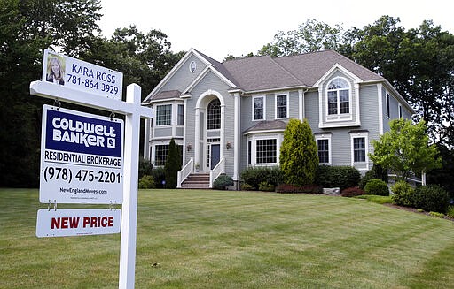 FILE - This July 10, 2017, file photo shows a house for sale, in North Andover, Mass. Nearly a third of Americans who&#146;ve never previously bought a home say they plan to in the next five years, according to a survey commissioned by NerdWallet and conducted online by The Harris Poll among 2,007 U.S. adults in January 2020. (AP Photo/Elise Amendola, File)