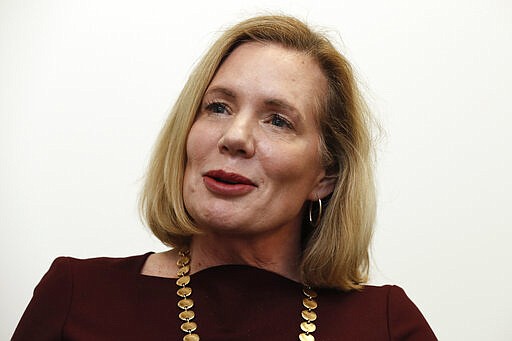 FILE - In this Thursday, Feb. 13, 2020, file photo, Holly Grange, who is running for the Republican nomination for governor in the North Carolina primary, speaks during an interview in Raleigh, N.C. (AP Photo/Gerry Broome, File)