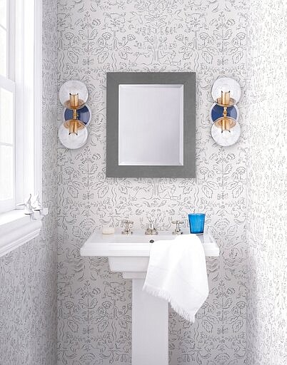 This photo provided by Hygge &amp; West shows Storyline Wallpaper in white. In lighting fixtures, wallpapers, bedding and wall art, floral design is having a big year in 2020. There's also a renewed interest in flower arranging and floral-inspired table settings. (Hygge &amp; West via AP)