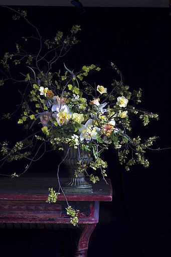 This photo shows a floral display featured in the book "Cultivated: The Elements of Floral Style" by Christin Geall. In lighting fixtures, wallpapers, bedding and wall art, floral design is having a big year in 2020. There's also a renewed interest in flower arranging and floral-inspired table settings. (Christin Geall/Princeton Architectural Press via AP)